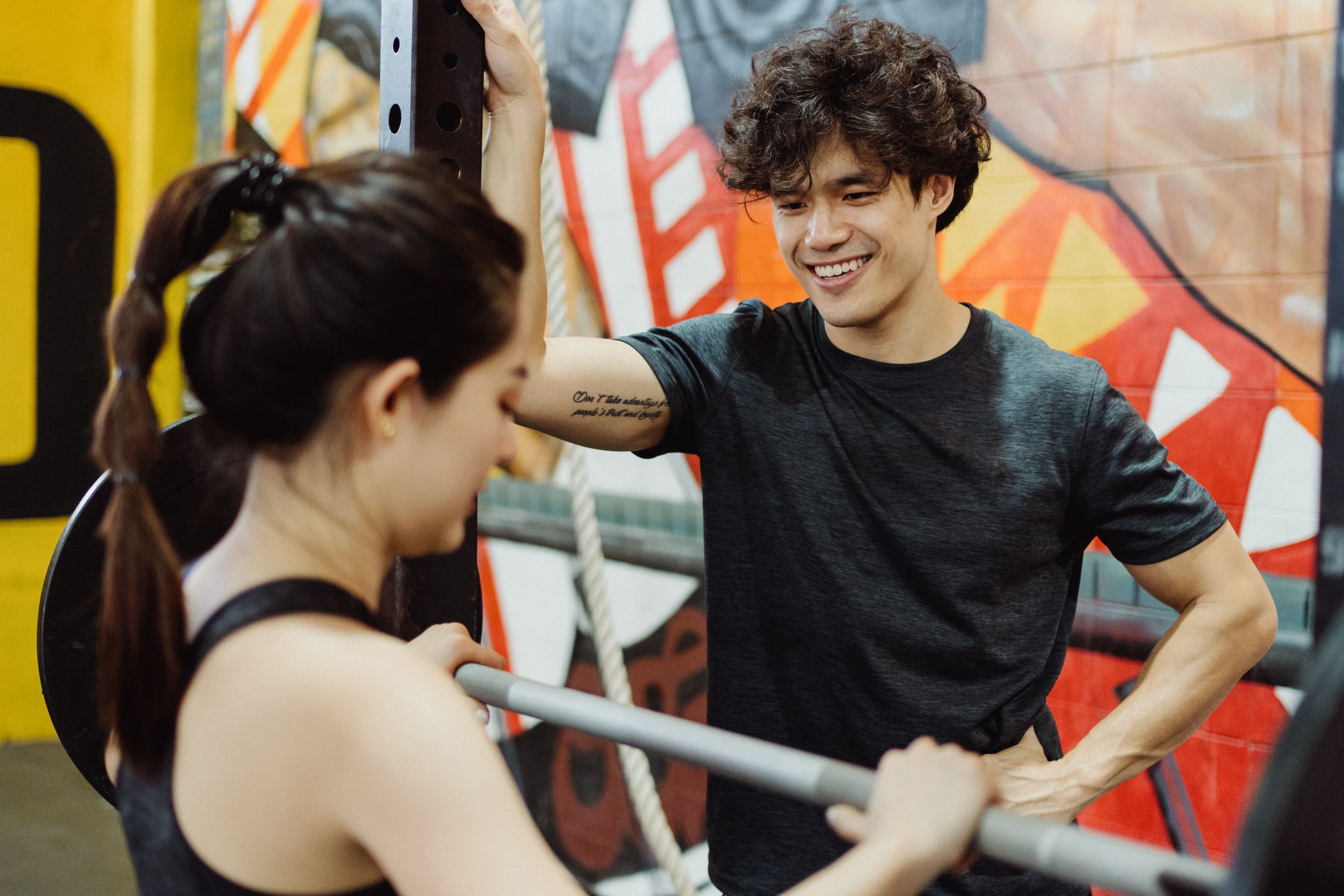 An adult athlete training with a coach